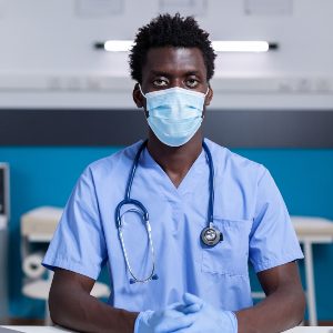 portrait-of-african-american-man-with-nurse-occupa-9CD6H3R.jpg